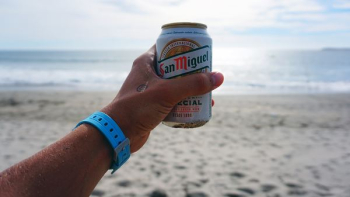 Person Holding San Miguel Beer Tin Can Person Holding San Miguel Beer Tin Can