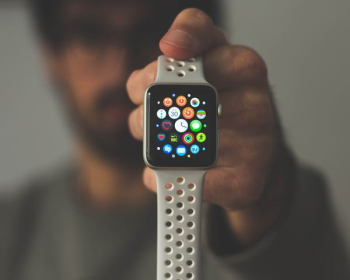 person holding silver aluminum case Apple Watch person holding silver aluminum case Apple Watch
