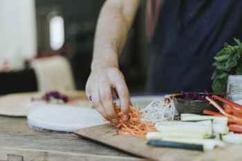 Person Holding Sliced of Carrots Person Holding Sliced of Carrots