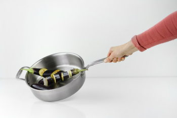 Person Holding Stainless Steel Casserole Person Holding Stainless Steel Casserole