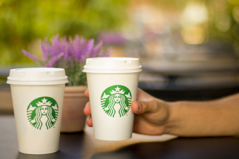 Person Holding Starbucks Plastic Cup