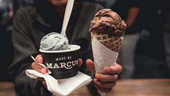 Person Holding Two Ice Creams Person Holding Two Ice Creams