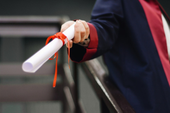 Person Holding White Scroll Person Holding White Scroll
