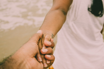 Person Holding Woman&#39;s Hand