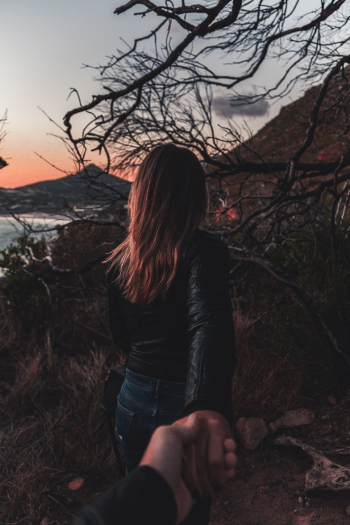 Person Holding Woman&#39;s Hand