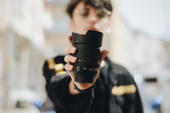 Person Holding Zoom Lens