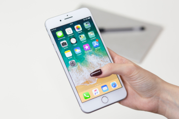 Person Holds Gold Iphone 7 Person Holds Gold Iphone 7
