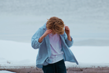 Person in Blue Button-up Shirt and Blue Bottoms