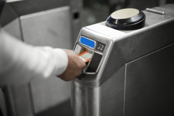 Person Inserting Card In Machine Person Inserting Card In Machine