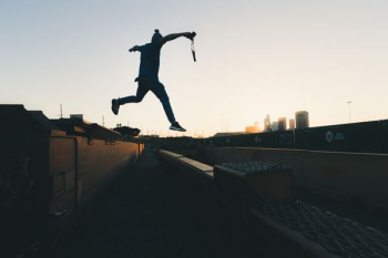 person jump through building person jump through building