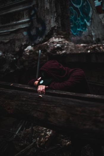 person leaning on wooden surface