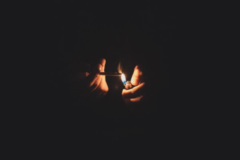 person lighting cigarette person lighting cigarette