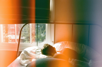 Person Lying in Bed Beside Window Person Lying in Bed Beside Window