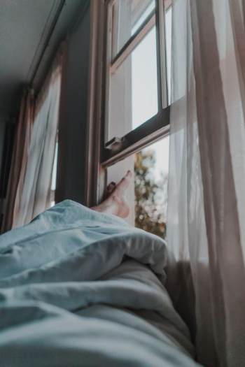 person lying near window person lying near window