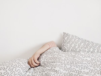person lying on bed person lying on bed