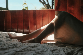 Person Lying on Bed Near Window Person Lying on Bed Near Window