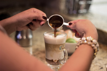 Person Making a Cappuccino Coffee Person Making a Cappuccino Coffee