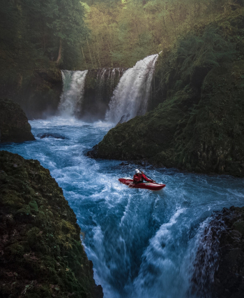 Person on Watercraft Near Waterfall Person on Watercraft Near Waterfall