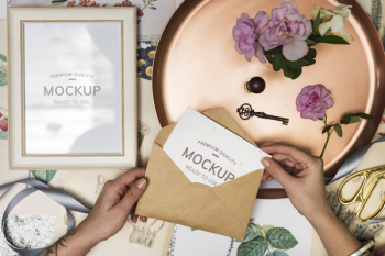 Person Opening Brown Envelope With White Invitation Letter