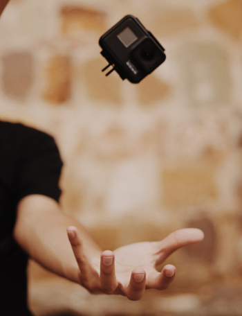 Person Opening Hand About To Catch Gopro Action Camera Person Opening Hand About To Catch Gopro Action Camera