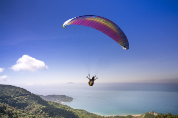 Person Paragliding Person Paragliding