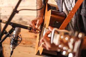 Person Playing Acoustic Guitar Person Playing Acoustic Guitar