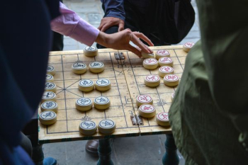 person playing board game person playing board game