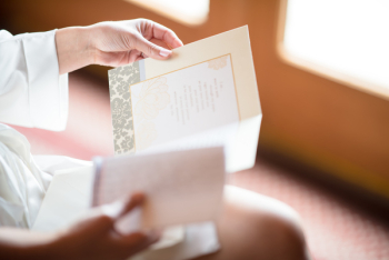 Person Reading A Card Person Reading A Card