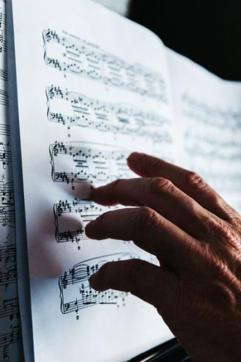 person reading musical note person reading musical note