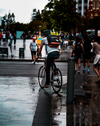 Person Riding Bike on Road Person Riding Bike on Road