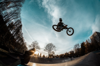 Person Riding Bike While in Mid Air in Skate Par