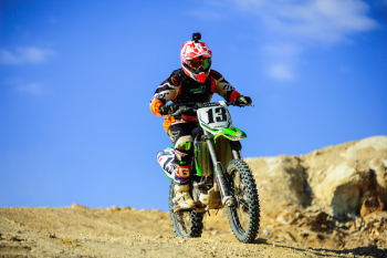 Person Riding Motocross Dirt Bike Person Riding Motocross Dirt Bike