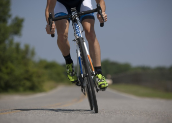 Person Riding Road Bike on the Road Person Riding Road Bike on the Road