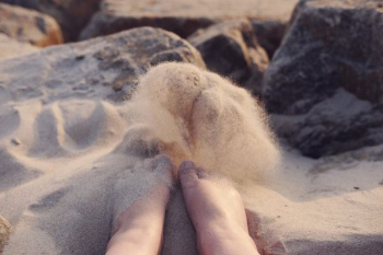 person's feet on sand person's feet on sand