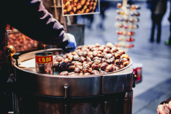 Person Selling Chestnuts Person Selling Chestnuts