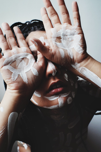 Person Showing Painted Hands and Face Person Showing Painted Hands and Face