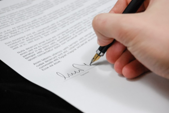 Person Signing in Documentation Paper Person Signing in Documentation Paper