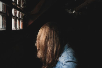 person sitting beside window person sitting beside window