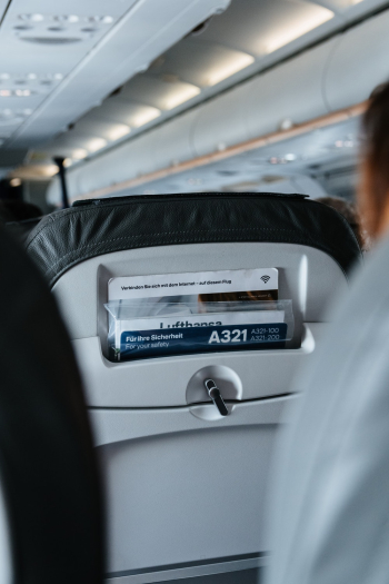 Person Sitting Inside Airliner Seat Person Sitting Inside Airliner Seat