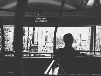 person sitting inside vehicle during daytime person sitting inside vehicle during daytime