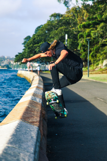 Person Skateboarding Near Lakeside Person Skateboarding Near Lakeside
