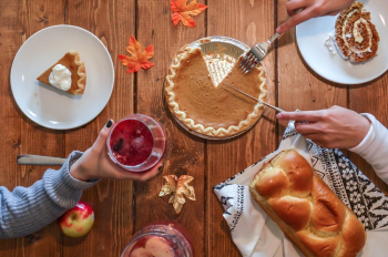 Person Slicing Pie on Aluminum Plate Person Slicing Pie on Aluminum Plate