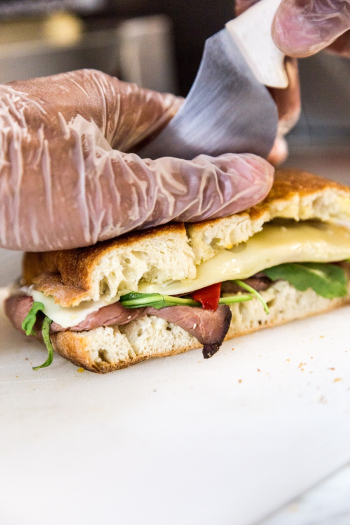 Person Slicing Sandwich Bread Person Slicing Sandwich Bread