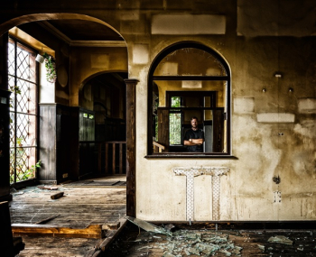 Person Standing Behind Black Wooden Window Person Standing Behind Black Wooden Window