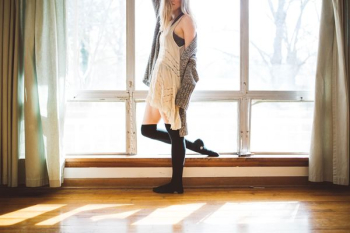 person standing beside window person standing beside window