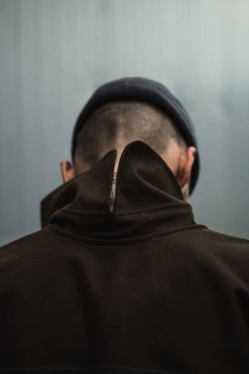 person standing near gray surface person standing near gray surface