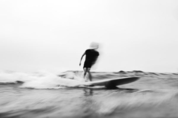 person surfing grayscale photo