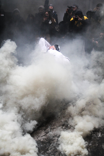 Person Surrounded With Smokes Near People Person Surrounded With Smokes Near People