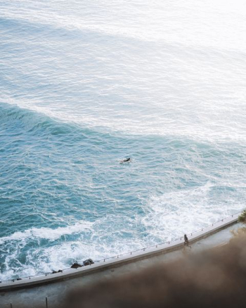 person swim on body of water person swim on body of water