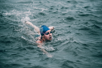 Person Swimming in Ocean Person Swimming in Ocean